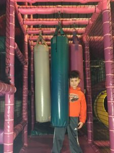 boy with punching bags